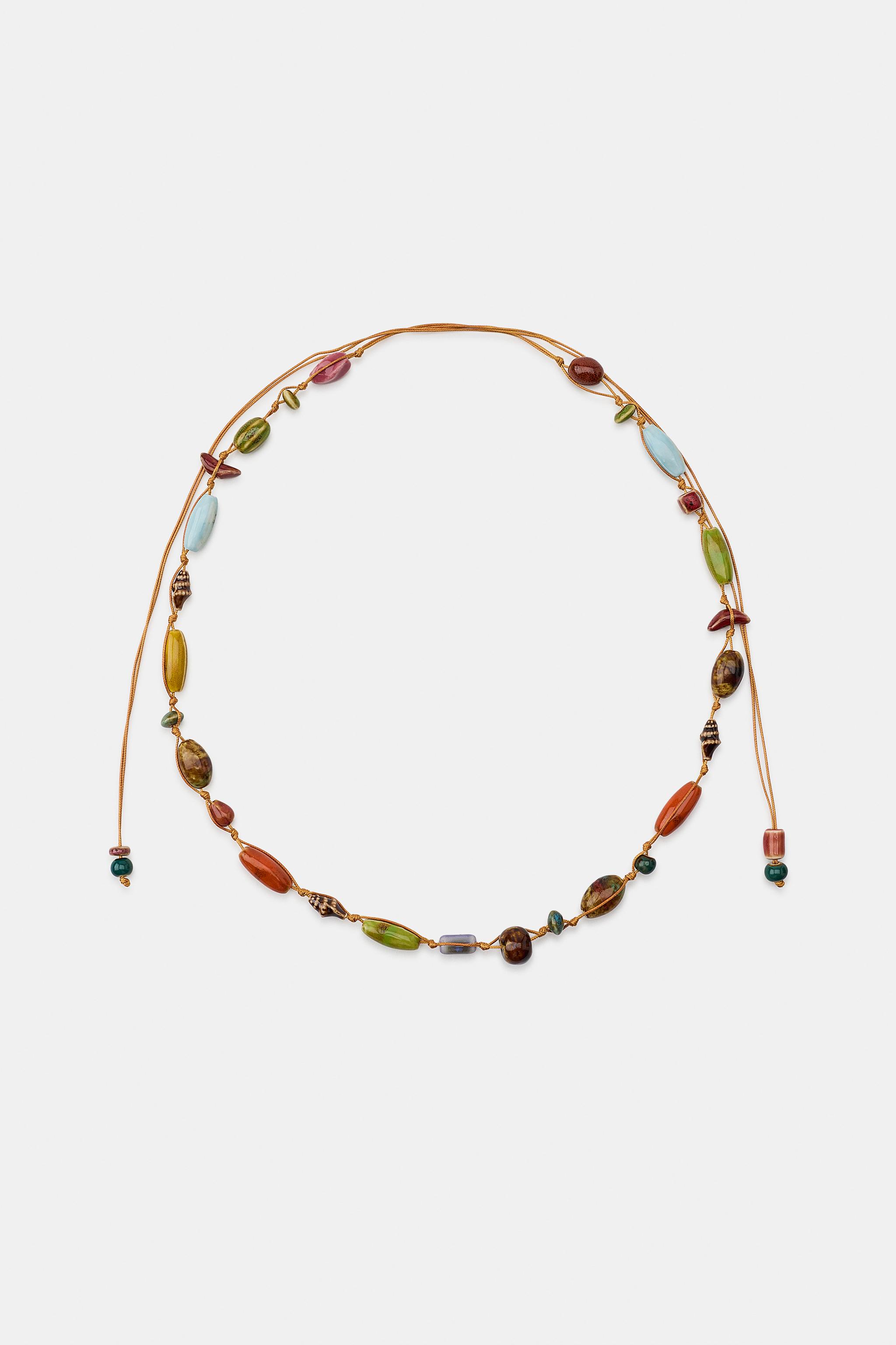 CEINTURE-LACET À PIÈCES EN CÉRAMIQUE